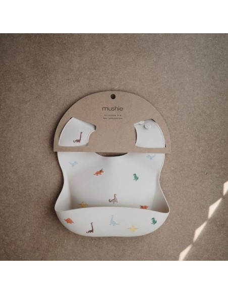 Bavoir souple en silicone Mushie Dinosaures